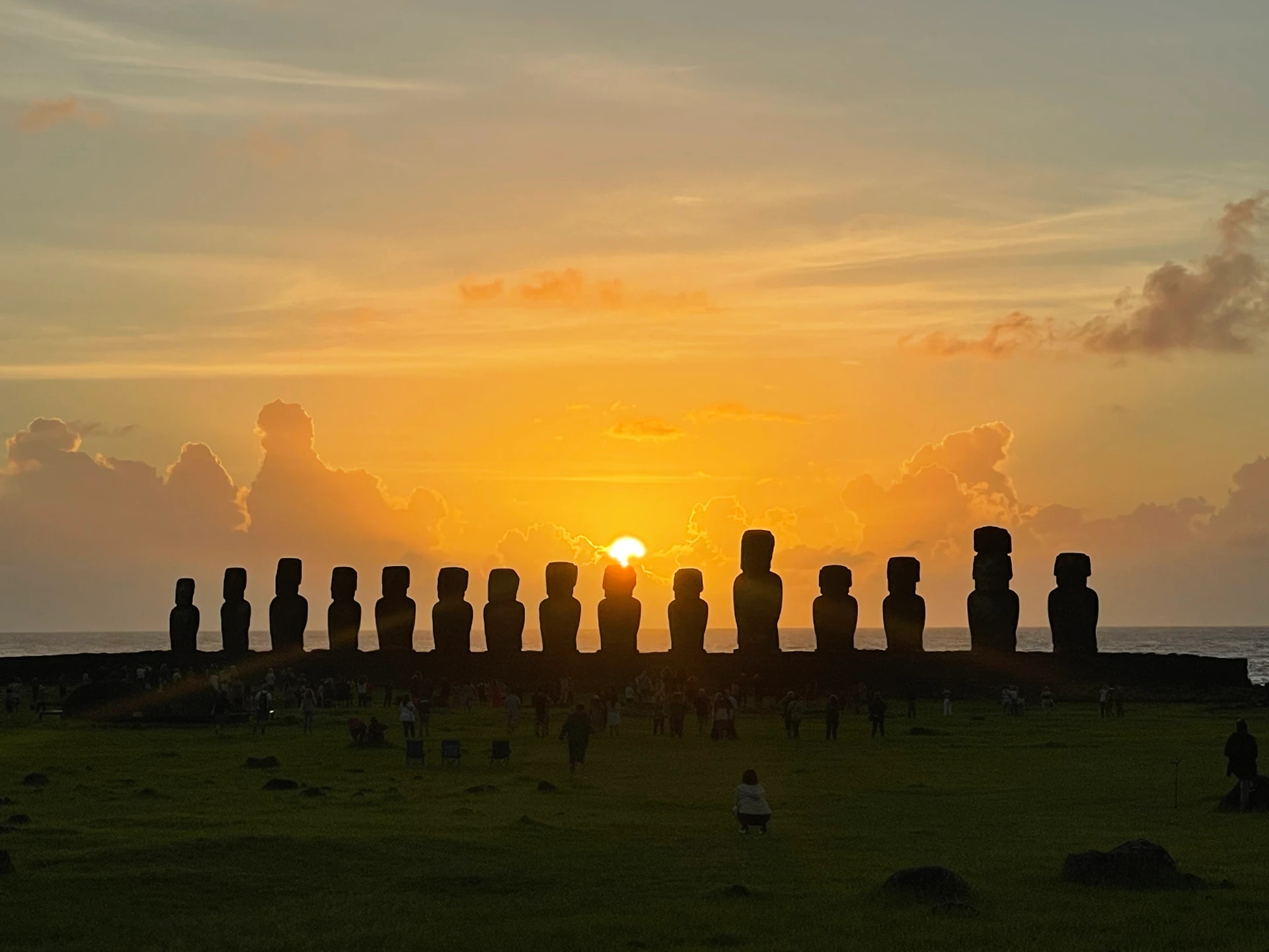 The sun rising between the fifteen moai of Ahu Tongariki