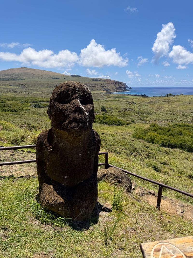 The kneeling Tukuturi moai and the landscape around Rano Raraku